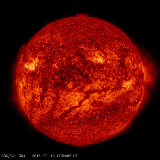 hotter surface of the sun, the cooler material in a prominence looks dark