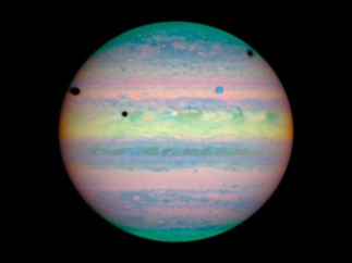 A rare triple eclipse seen on the cloud tops of Jupiter by the Hubble Space Telescope on March 28, 2004.