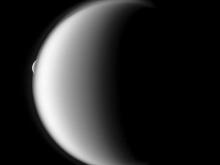 Saturn’s largest moon, Titan occults its much smaller moon, Rhea. Image Credit: NASA Cassini Mission